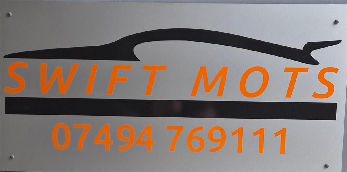 Swift MOTs business sign showing the phone number 07494 769111